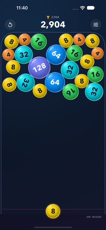 Bubbler 2.0 gameplay with colourful numbered bubbles on a dark blue board